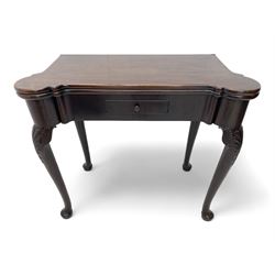 Late 18th century Irish mahogany tea table, rectangular form with projecting stepped rounded corners, fold-over action top over single frieze drawer within cock-beaded surround, on shell and bellflower carved cabriole supports, single gate-leg action base 