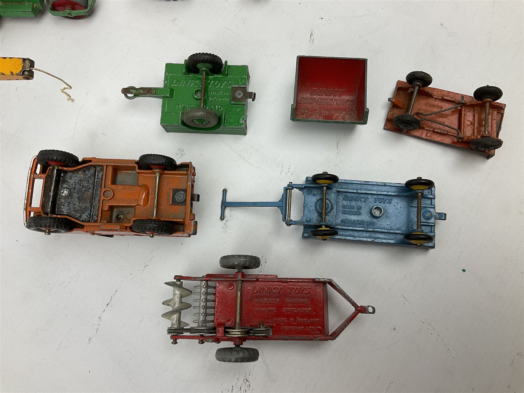 Dinky - nineteen unboxed and playworn/repainted die-cast models including Muir Hill Dumper, Muir Hill 2WL and Heavy Tractor; all repainted; Coles Mobile Crane, two Aveling-Barford steam rollers; Massey-Harris tractor and manure spreader; Land Rover; nine various trailers etc (19)