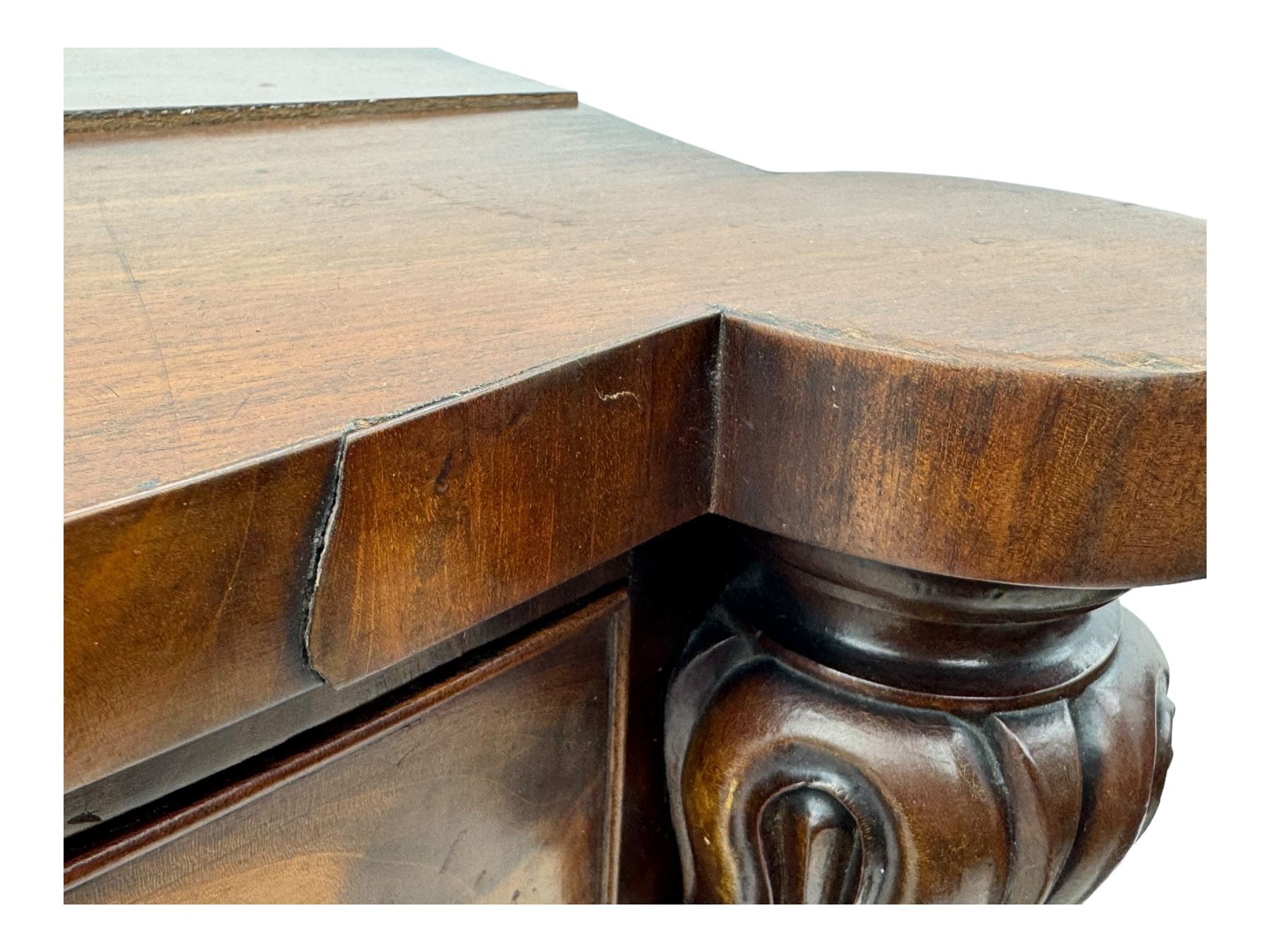 Early Victorian mahogany bow front chest, two short over three long graduating cockbeaded drawers, flanked by faceted columns with carved acanthus leaf capitals, standing on turned bun supports with fluted detailing