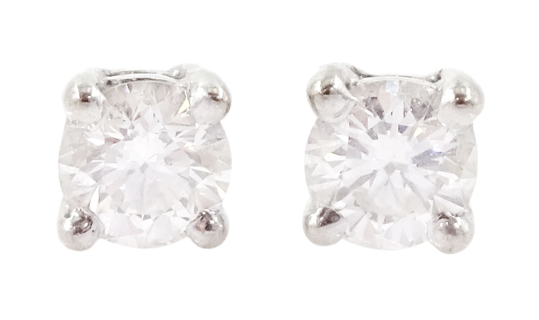 Pair of 18ct white gold round brilliant cut diamond stud earrings, Sheffield 2000, total diamond weight approx 0.30 carat