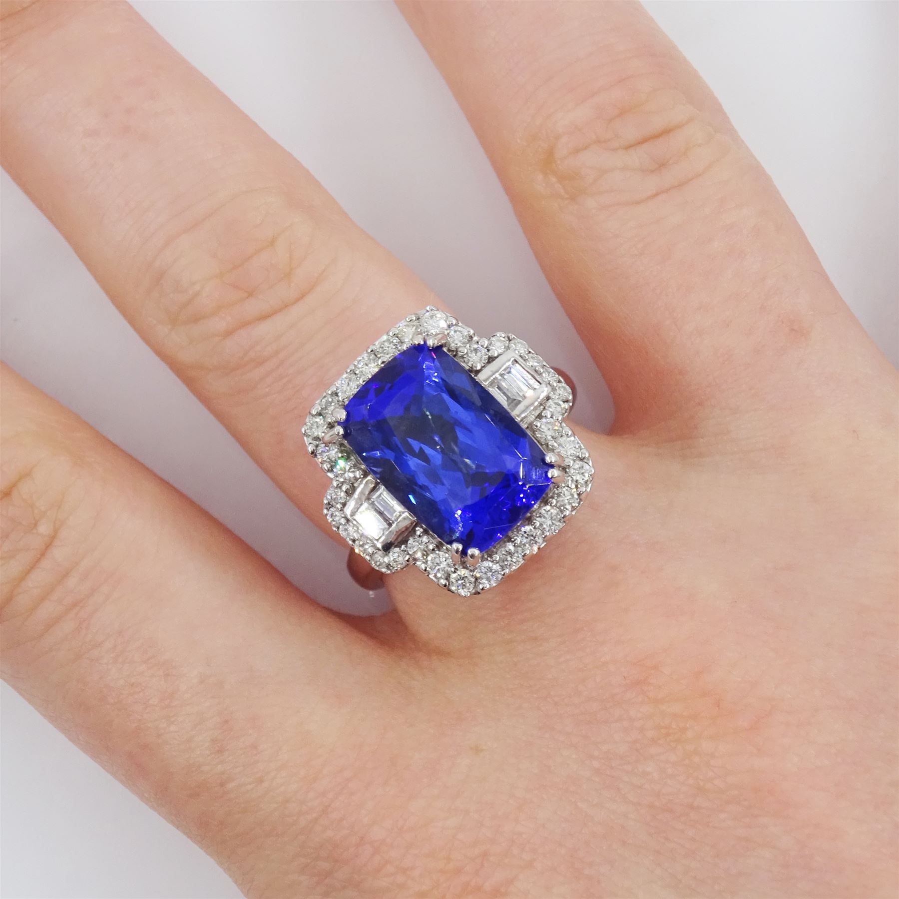 18ct white gold tanzanite, baguette and round brilliant cut diamond cluster ring, stamped 750, tanzanite approx 6.15 carat, total diamond weight approx 0.65 carat