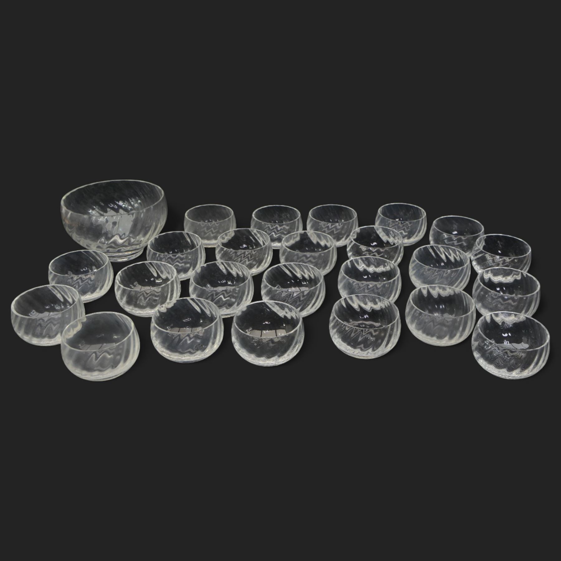 Dartington Ripple pattern fruit set comprising thirty bowls and serving bowl and a number of plain glass champagne saucers