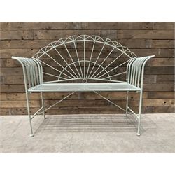 Wrought metal two seat garden bench, sunburst back, painted in pale green finish