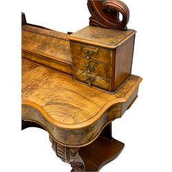 19th century figured walnut dressing table, the raised bevelled mirror back in carved foliage frame with scrolled terminals, fitted with central hinged compartment flanked by small trinket drawers, serpentine moulded top over single frieze drawer, on cabriole supports united by a platform base