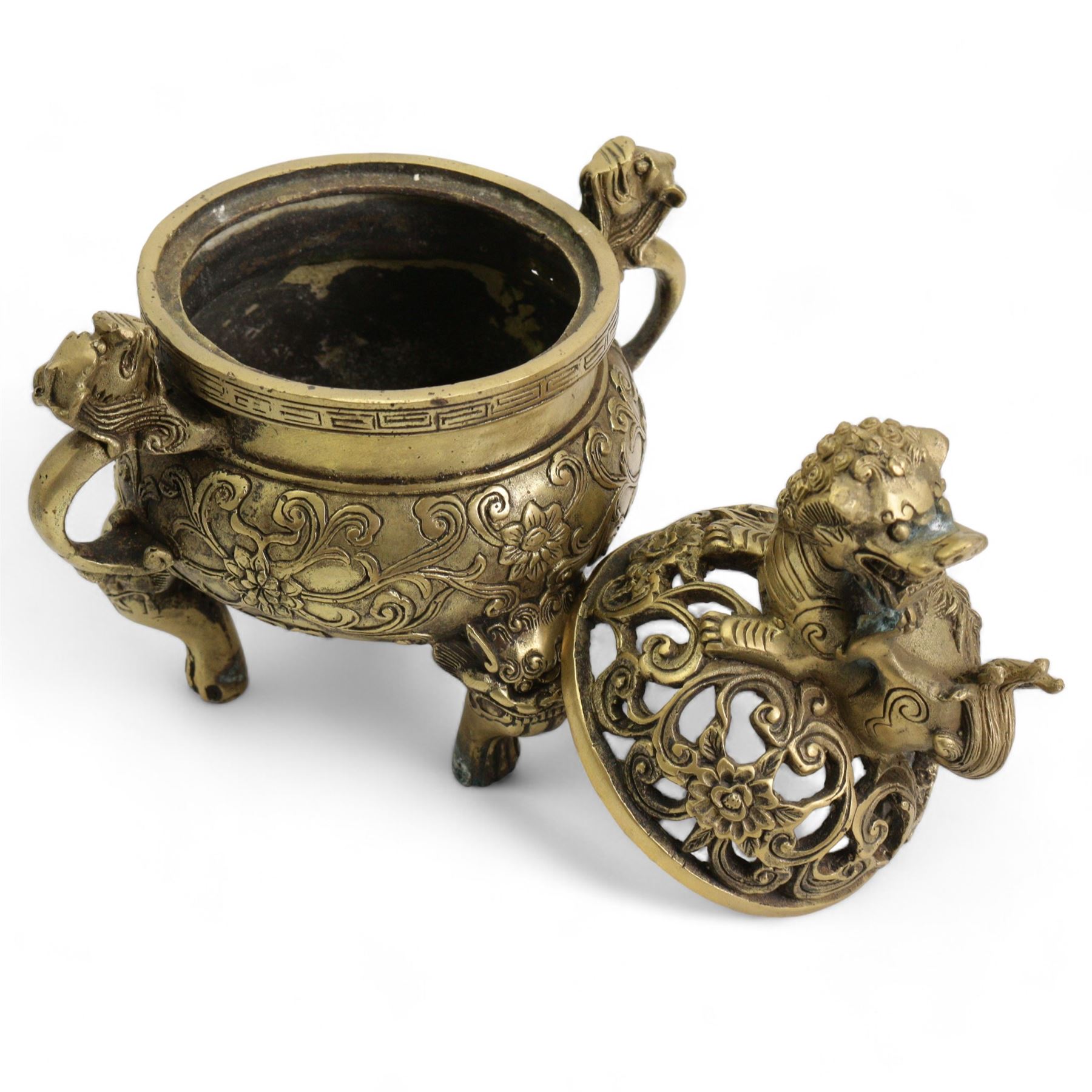 Chinese polished bronze incense burner and cover, pierced domed cover with temple lion finial, the base cast with scrolling foliage on tripod temple lion mask legs, Xuande seal mark, H18cm 