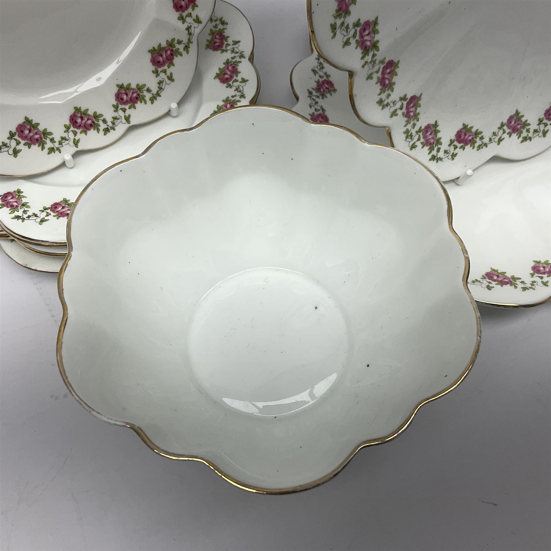 Shelley Late Foley part tea service, pattern number 10137, decorated with roses, comprising eleven teacups and twelve saucers, milk jug, sugar bowl, twelve side plates and two sandwich plates (39)