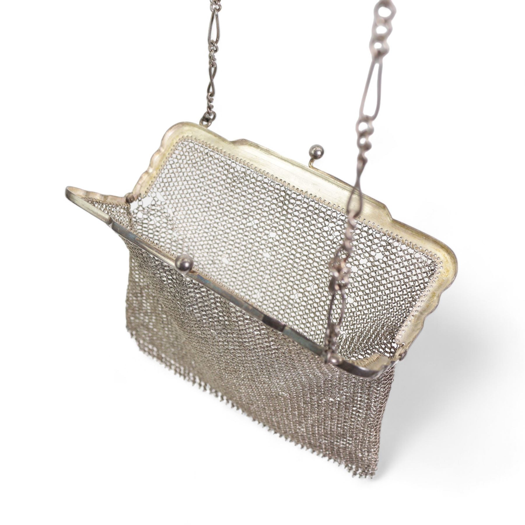 Silver mesh evening purse with long and short link strap, hallmarked import Birmingham 1913, together with an iron mesh evening purse with acorn drops, and a silver hair comb (3)