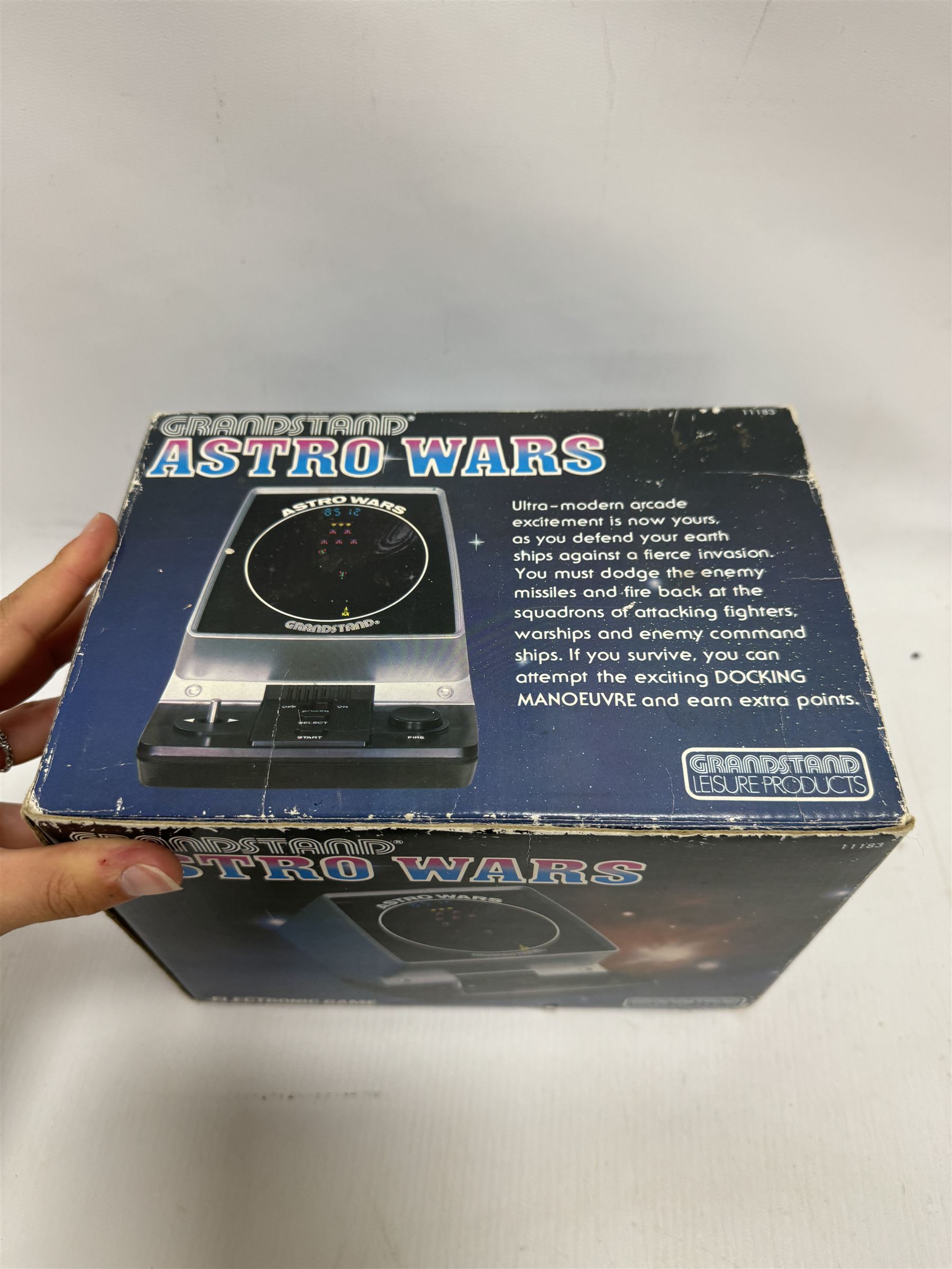 Three 1980s Nintendo Game & Watch handheld electronic games, to include a boxed Multi Screen Mario Bros example and two unboxed single screen examples Parachute and Fire, together with a Grandstand Astro Wars electronic game, boxed with instructions