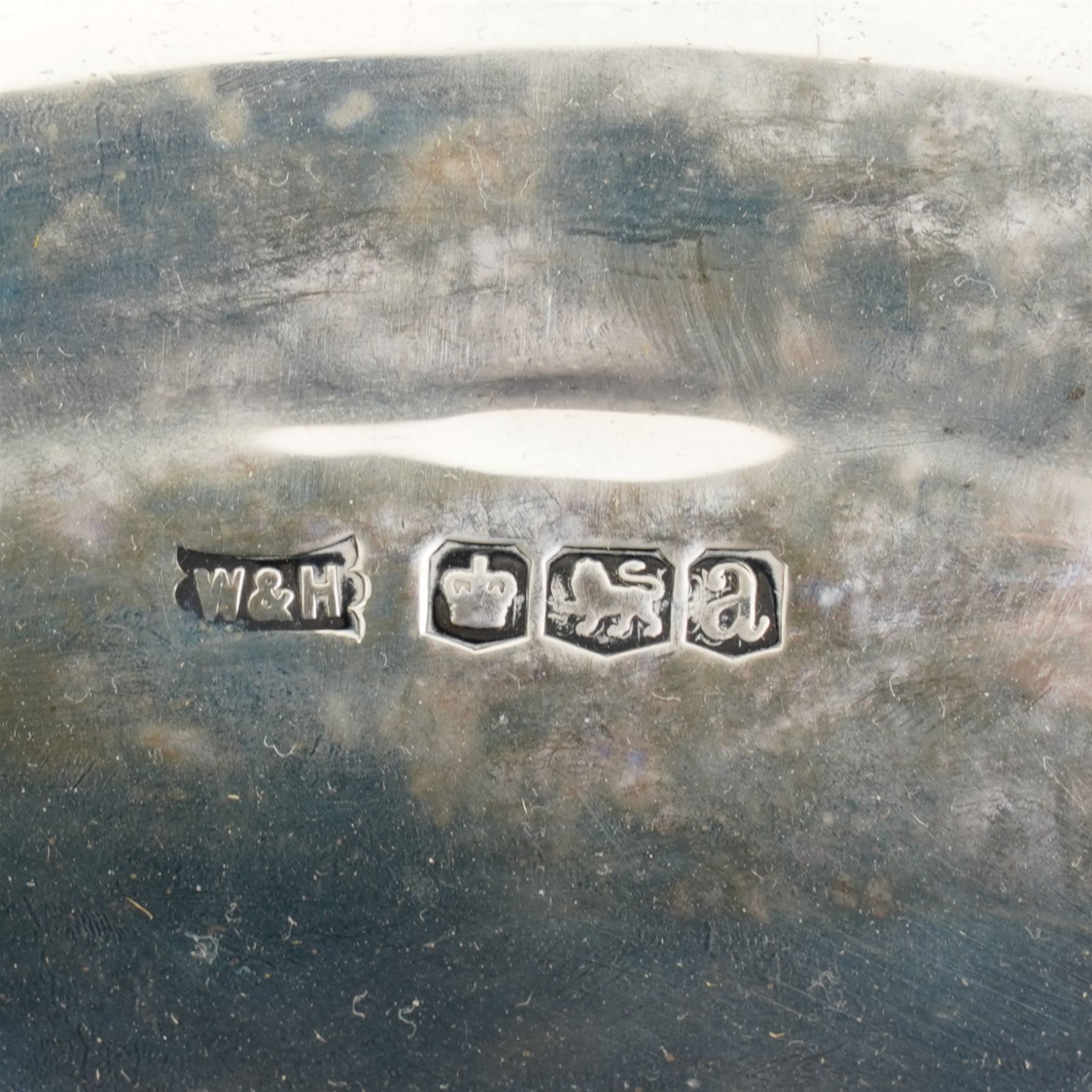 Silver circular fruit dish with swing handle of panelled design on a pedestal base and  octagonal foot D28cm Sheffield 1918 Maker Walker & Hall  