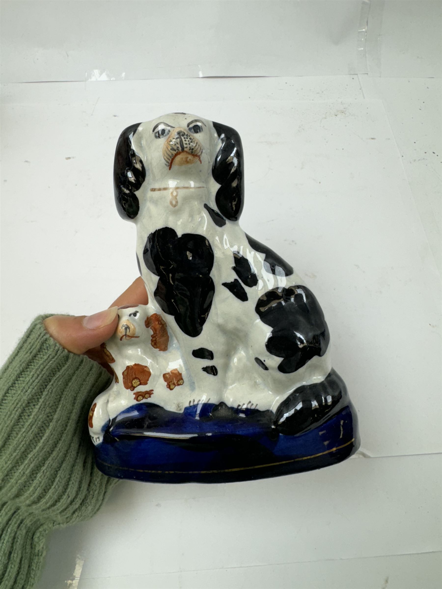 Pair of standing Staffordshire whippets with rabbits in their mouths, together with a pair of Staffordshire spaniels, whippets H30cm