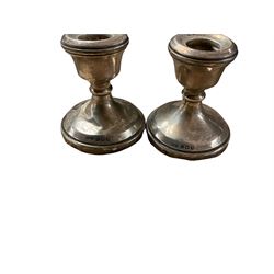 Silver candlesticks, hallmarked, together with silver brush and scent bottles with silver collars and other items  