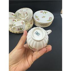 Coalport part tea service, decorated with floral sprigs, including eight cups and saucers, milk jug, eight dessert plates etc  