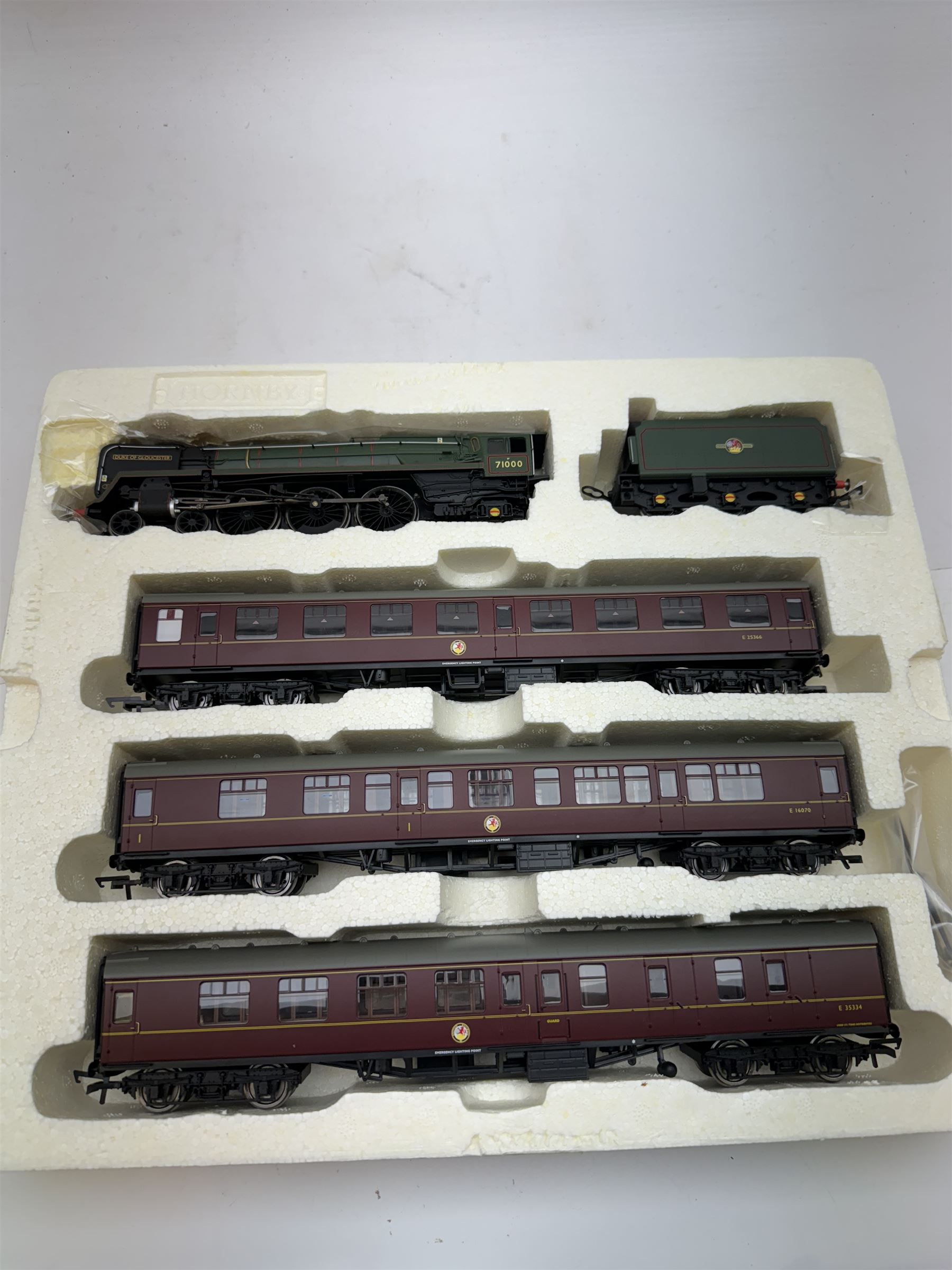 Hornby '00' gauge DCC ready Heritage Rail Express Train Pack R3192, comprising Class 8P 4-6-2 'Duke of Glouscester' locomotive no. 71000 in BR green, MkI Composite Coach no. EI6070, MkI Corridor Coach no. E25366 and MkI Brake Coach no. E35334, in original box