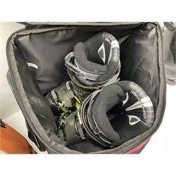 Three sets of Salomon ski boots (two as new), together with associated clamps