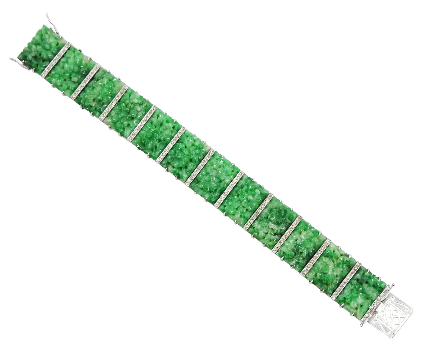 Art Deco platinum and white gold jadeite and diamond bracelet, twelve carved foliate jadeite panels, separated by a row of milgrain set old cut diamonds