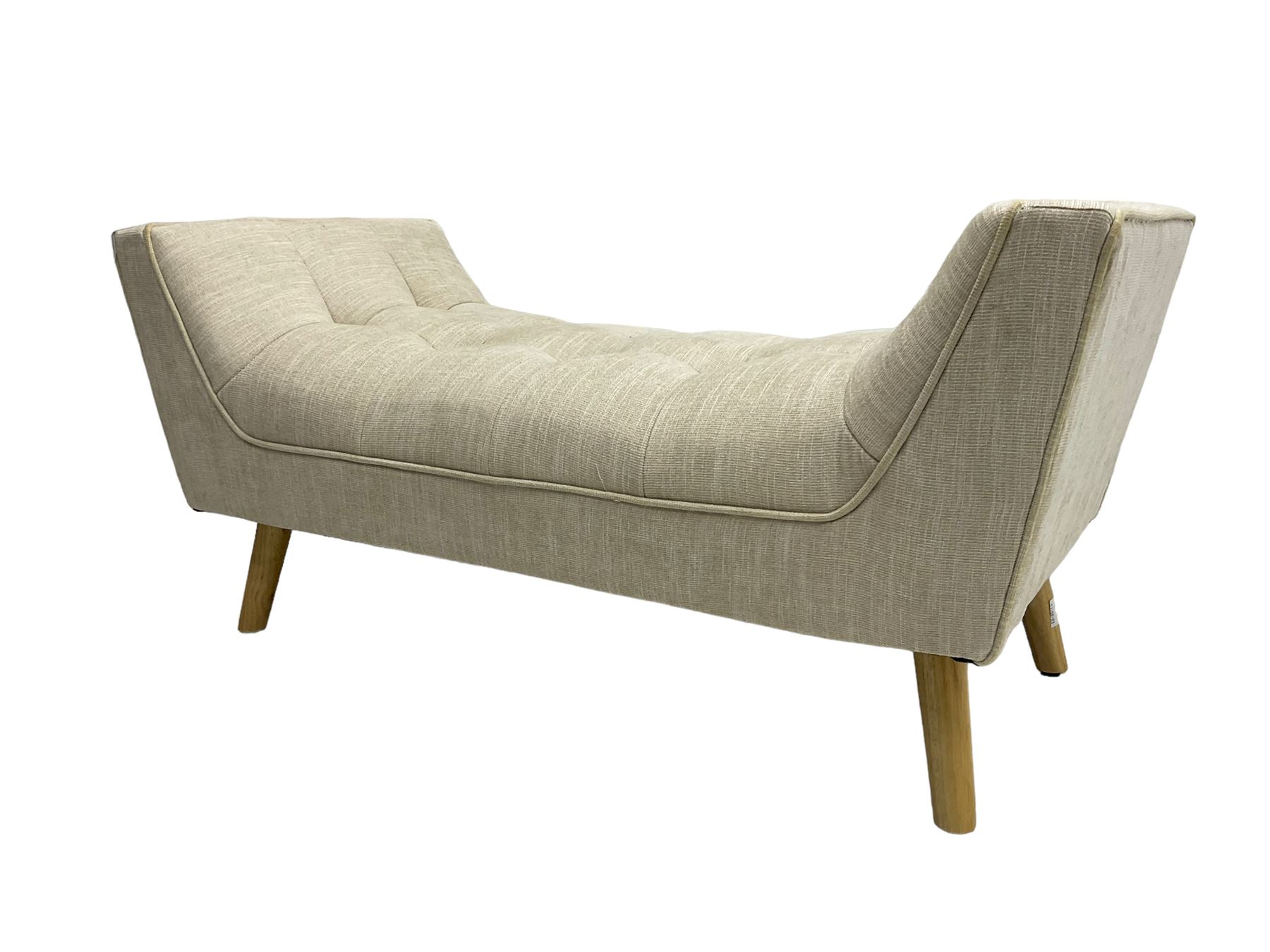 Contemporary U-shaped window or bed stool, upholstered in buttoned neutral fabric