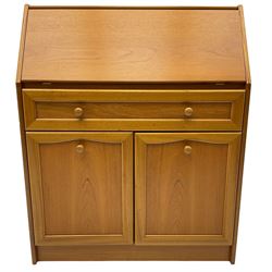 Mid 20th century teak bureau, sloped fall-front opening to reveal fitted interior with compartments, over panelled full width drawer and two cupboard doors, on recessed plinth base