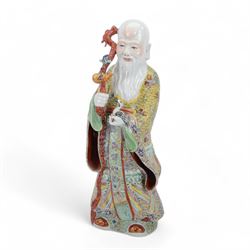 Chinese Republic Period porcelain figure, modelled as Shoulao, wearing elaborately enamell...