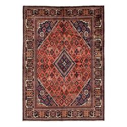 Persian Joshgan red ground rug, the medallion, field and spandrels decorated with clusters...