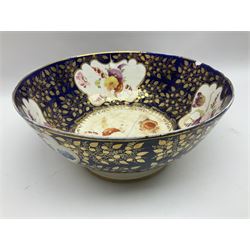 19th century continental bowl, decorated with hand painted floral sprays amongst gilt foliate decoration on a cobalt blue ground, D27.5cm