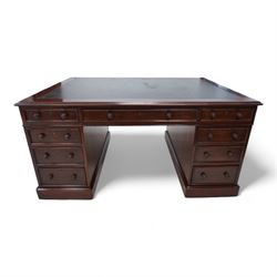 Victorian mahogany twin pedestal desk, moulded rectangular top with leather inset, one side fitted with nine drawers, the opposing side fitted with three drawers and two cupboards, two panelled doors enclosing further drawers, on moulded plinth base 