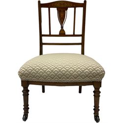 Early 20th century mahogany side chair, detailed marquetry frame, backrest with central urn motif and scrollwork inlay, arched crest rail with floral designs, cream and gold patterned fabric seat, turned front legs with brass castors (H78cm); Victorian walnut nursing chair, carved crest rail, floral needlepoint tapestry upholstery, turned front legs with ceramic castors (H81cm)