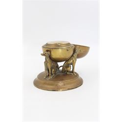 19th century brass desk inkwell, the central spherical chamber supported by three seated hounds, upon a circular base, H10.5cm, together with a further brass example modelled as a dog and dog kennel with hinged roof opening to reveal an inkwell, upon oval base, and white marble plinth, overall H7.5cm W16cm 