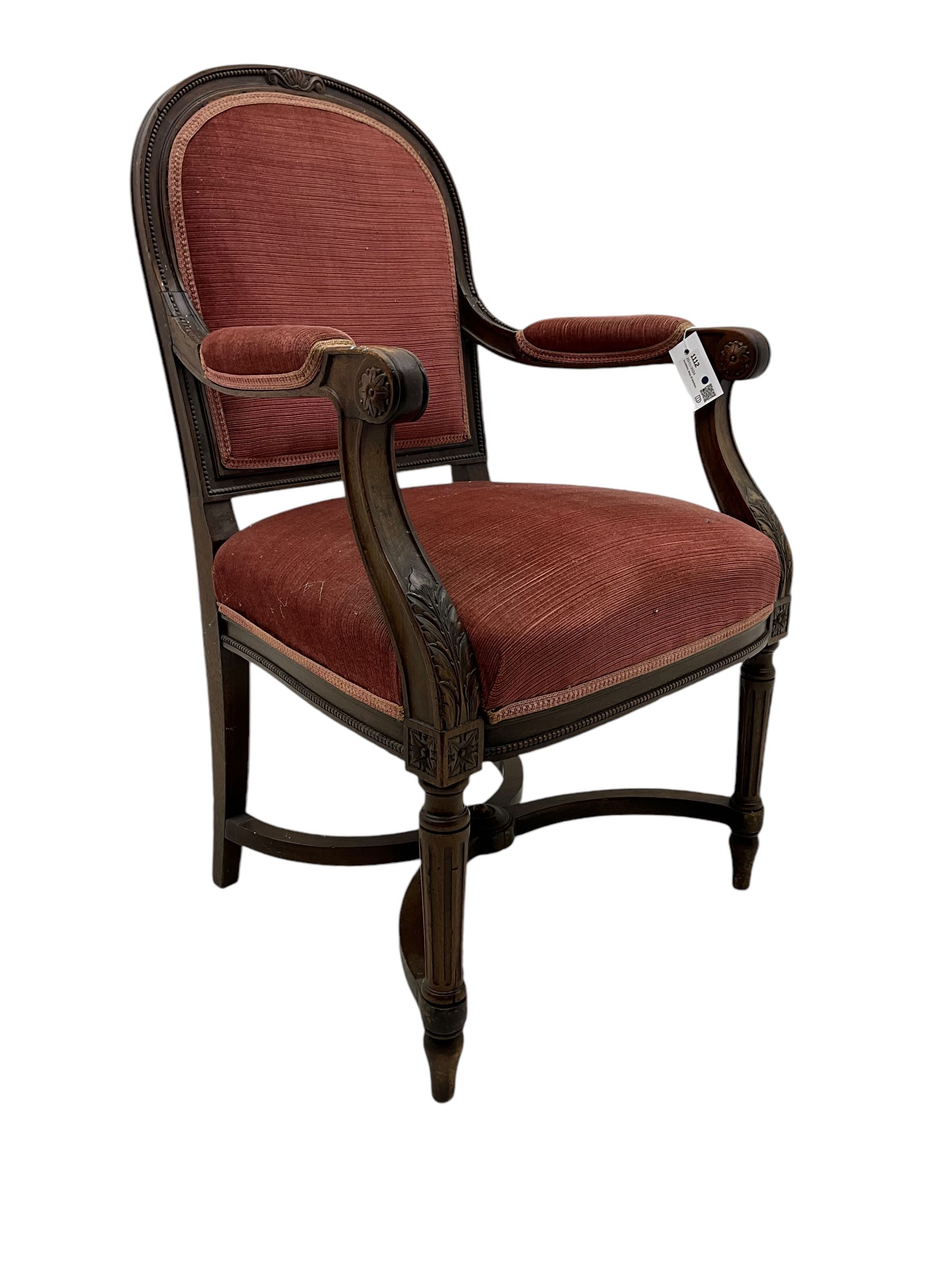 20th century French design mahogany fauteuil armchair, moulded and beaded framed, upholstered in pink fabric, rolled arms over acanthus leaf carved supports, on turned and fluted front supports united by curved X-framed stretcher 