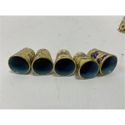 Ten cloisonne thimbles, decorated with, flowers, birds, dragons, butterflies, and other animals