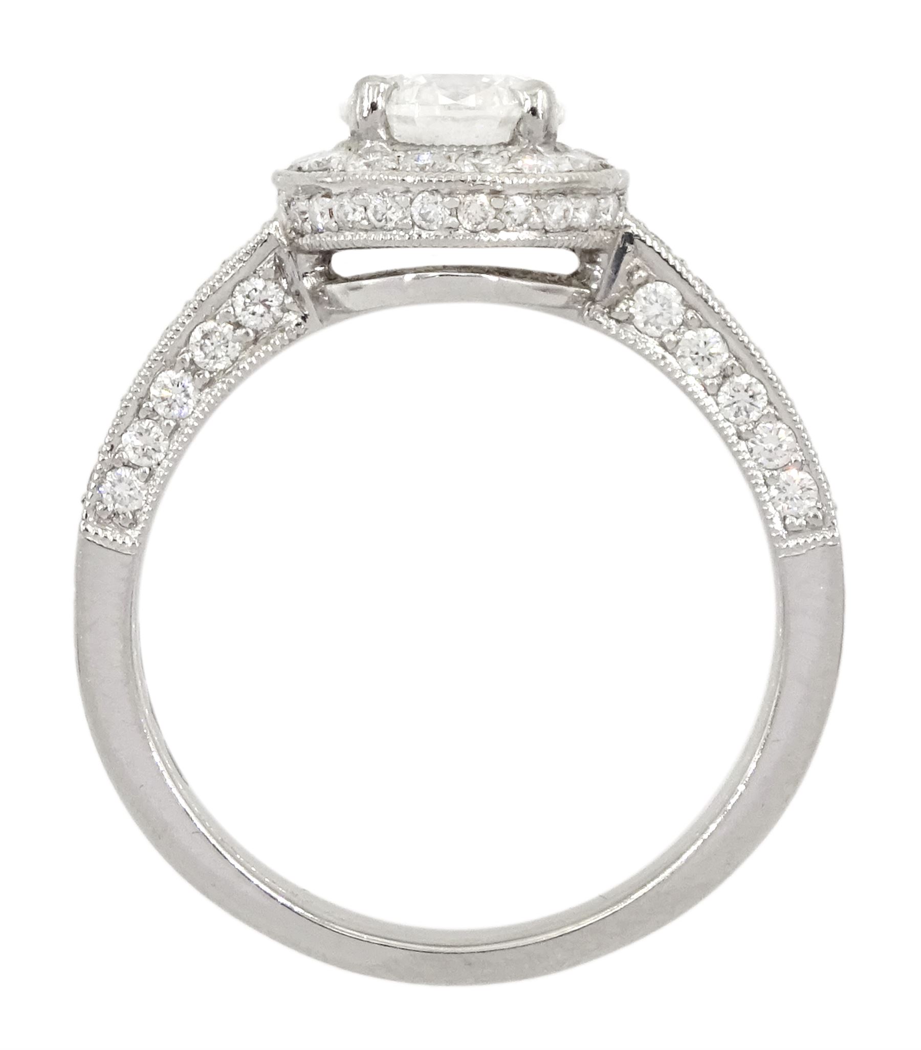 Platinum single stone round brilliant cut diamond ring, with pave set diamond surround, gallery and shoulders, principal diamond approx 0.90 carat, with platinum diamond set band, both hallmarked