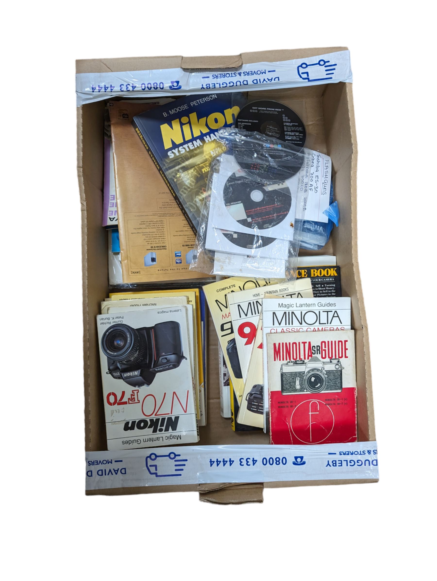 Camera reference books, user guides, instruction manuals, etc, mostly for Nikon and Minolta cameras