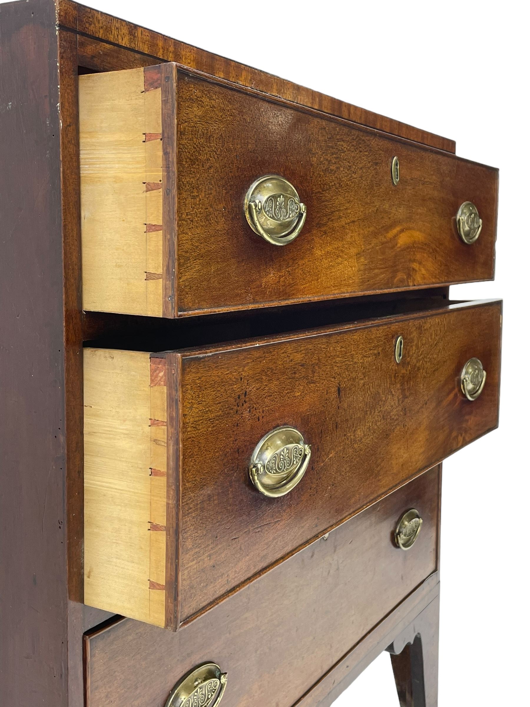 George III mahogany chest, rectangular ebony strung top, fitted with three graduating cock-beaded drawers with oval pressed brass handle plates and demi-lune handles, on tall bracket feet 