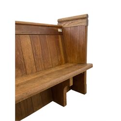 19th century oak church pew or hall bench, moulded cresting rail over panelled back and plank seat, on panelled end supports with chamfered frames