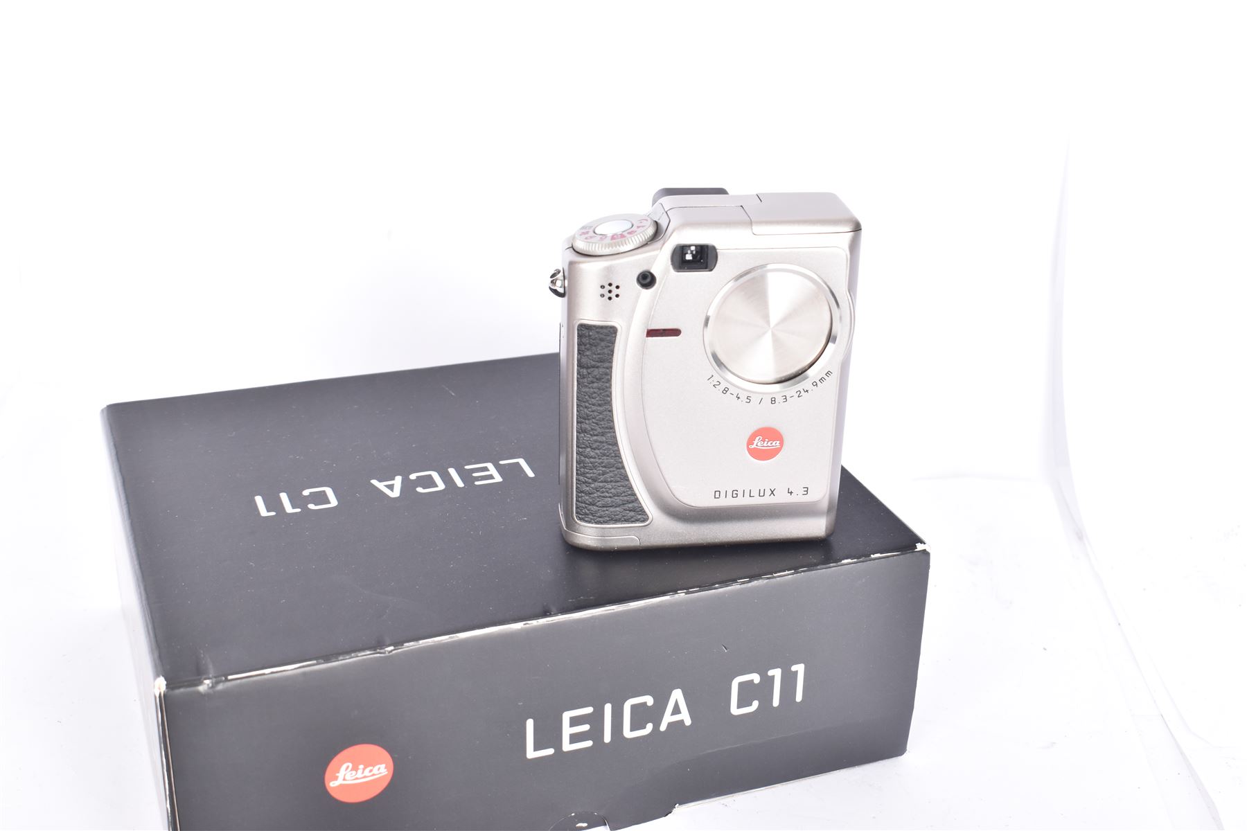 Leica C11 APS film compact camera, in silver and chrome finish, serial no. 2636834, in original clear hard case and box, with instruction booklet, together with a Leica Digilux 4.3, with 1:2.8-4.5/8.3-24.9mm lens, serial no. 2598862, with instruction booklet