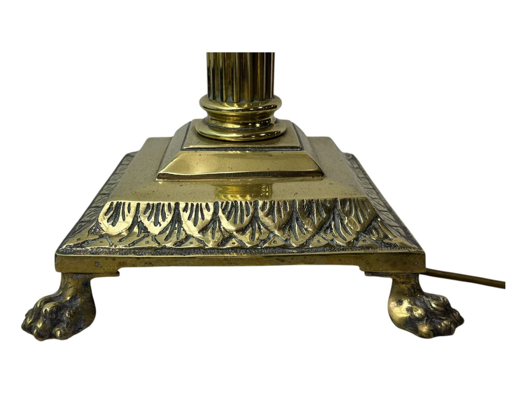 20th century brass standard lamp, Corinthian column stem on moulded square base with paw feet 