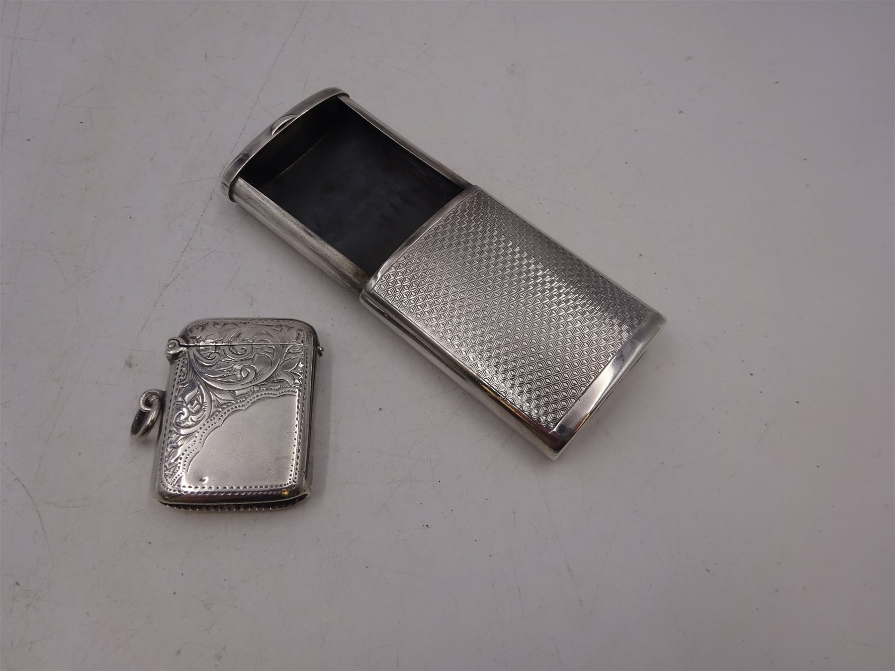 1920s silver sliding vesta case, with engine turned decoration, hallmarked Adie Brothers Ltd, Birmimgham 1928, together with a small silver vesta case, hallmarked