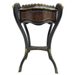 Late Victorian ebonised and amboyna wood jardinière planter, shaped form with removable lid inlaid with scrolling brass work and mounted by ornate cast gilt metal handles, the frieze rails inlaid with amboyna panels and brass stringing, on cabriole supports united by under-tier, decorated with cast gilt metal acanthus leaves and hooved feet caps