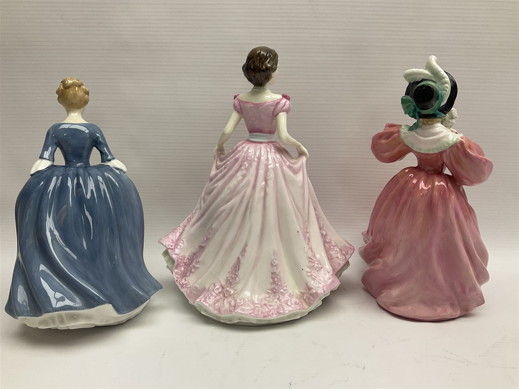 Nine Royal Doulton Figures including; Margarite HN1928, Autumn Breezes HN1034, Hope HN4097, Alison HN2336, Top of the Hill HN1834 and four others (9)