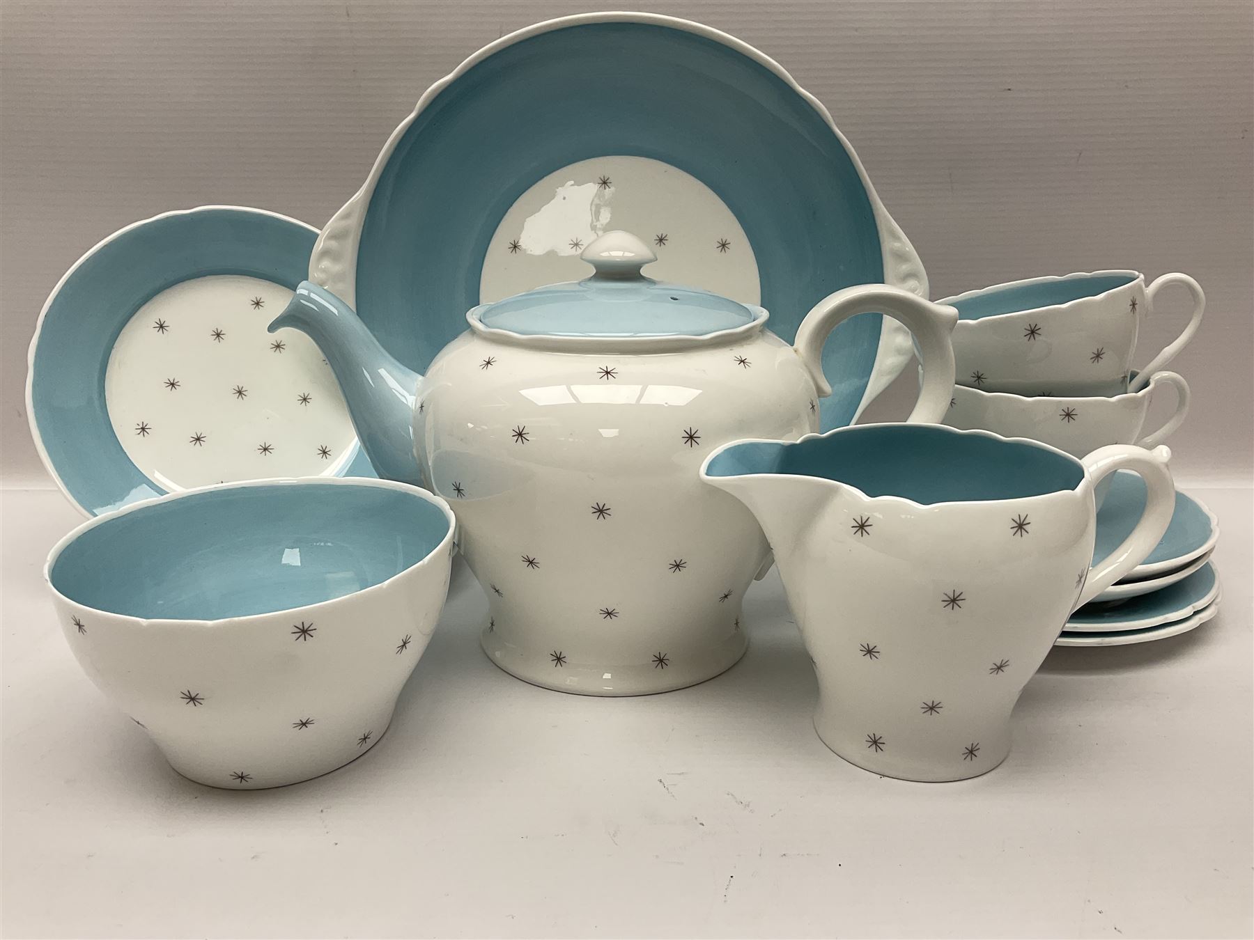 Shelly Pole Star pattern tea service for five comprising teapot, milk jug, open sucrier, cups and saucers, dessert plates and one cake plate 