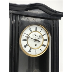 Early 20th century ebonised Vienna type wall clock, shaped pediment over arch glazed door, circular Roman dial with subsidiary seconds dial, single train driven movement stamped 'Schultz Marke, 104340', H104cm