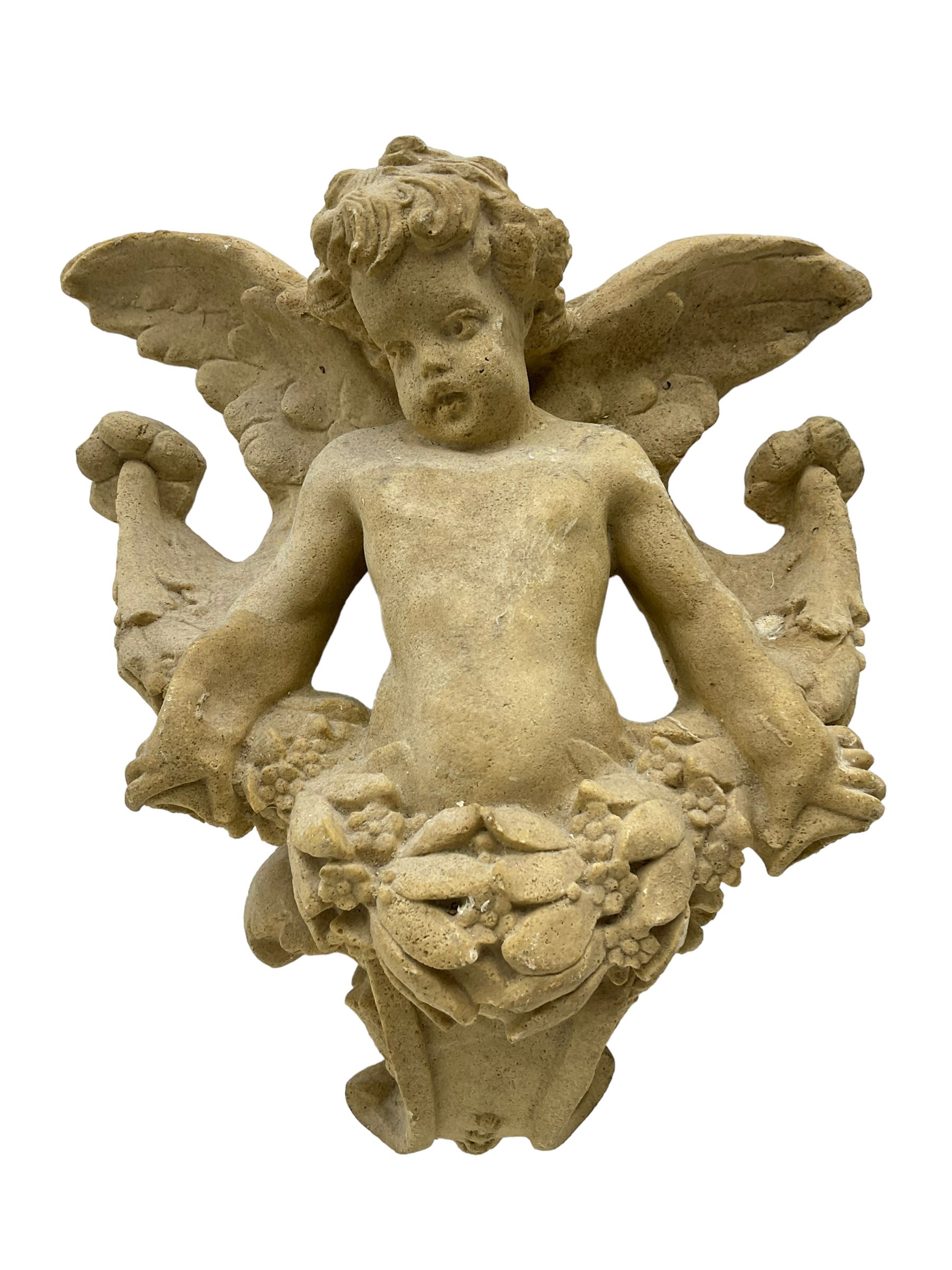 Sandstone finish moulded fibre-glass wall mounting figure of a winged cherub