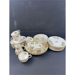 Coalport part tea service, decorated with floral sprigs, including eight cups and saucers, milk jug, eight dessert plates etc  