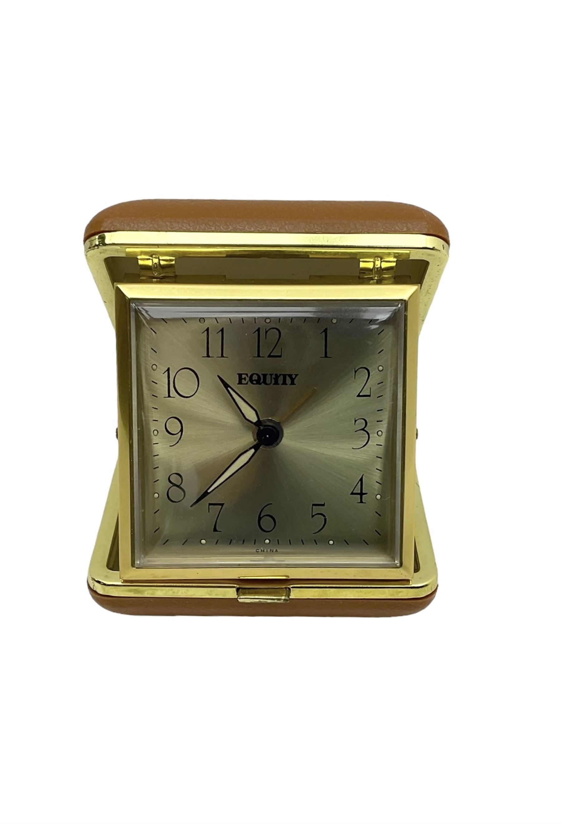 Two 20th century compact traveling alarm clocks -  in blue case with opening doors and an Equity travel clock, both wound and set from the rear.