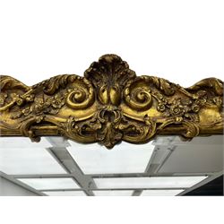 Large gilt framed rectangular wall mirror, shaped and moulded frame decorated with trailing curled acanthus leaves and flower head motifs, bevelled glass plate 