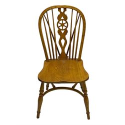 Set of four elm Windsor dining chairs, hoop and stick back with shaped wheel splat, dished seat on turned supports united by crinoline stretcher 