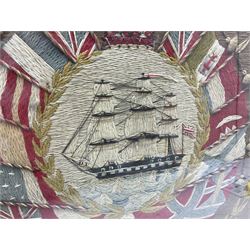 19th century woolwork, depicting a clipper ship, fully rigged over black hull with white ports, within a border of ensigns and flags and beaded crown above, in glazed wooden frame, H57cm