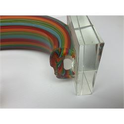 Three art glass sculpture, coiled form with multicolour stranded, upon clear glass plinth, unsigned, largest H27cm