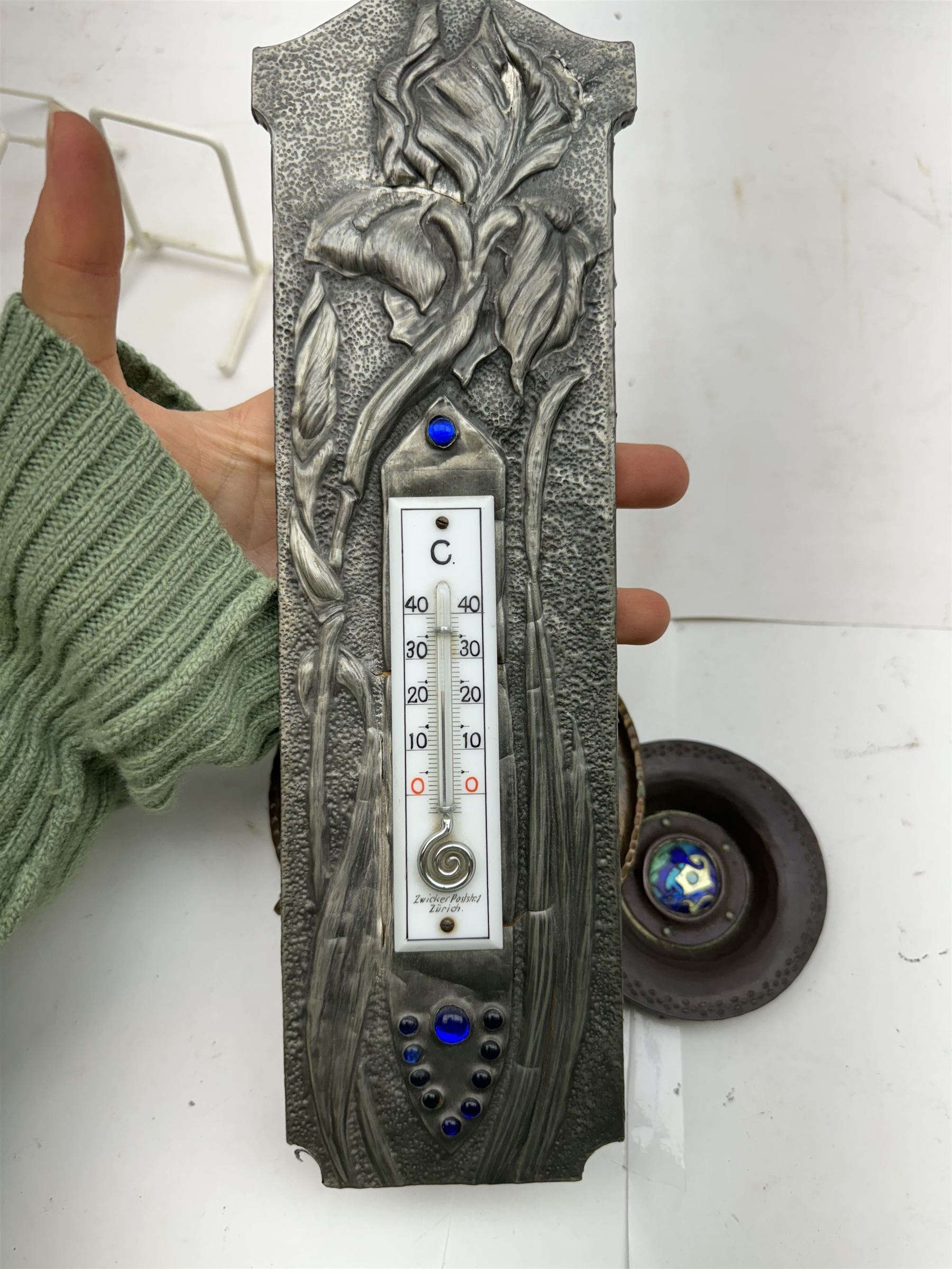 Art Nouveau silver mounted desk thermometer, embossed with floral sprigs, together with small dish with a enameled centre, and another hammered dish