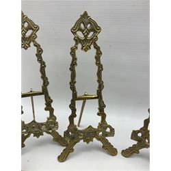 Set of six ornate cast brass easel stands, H30cm