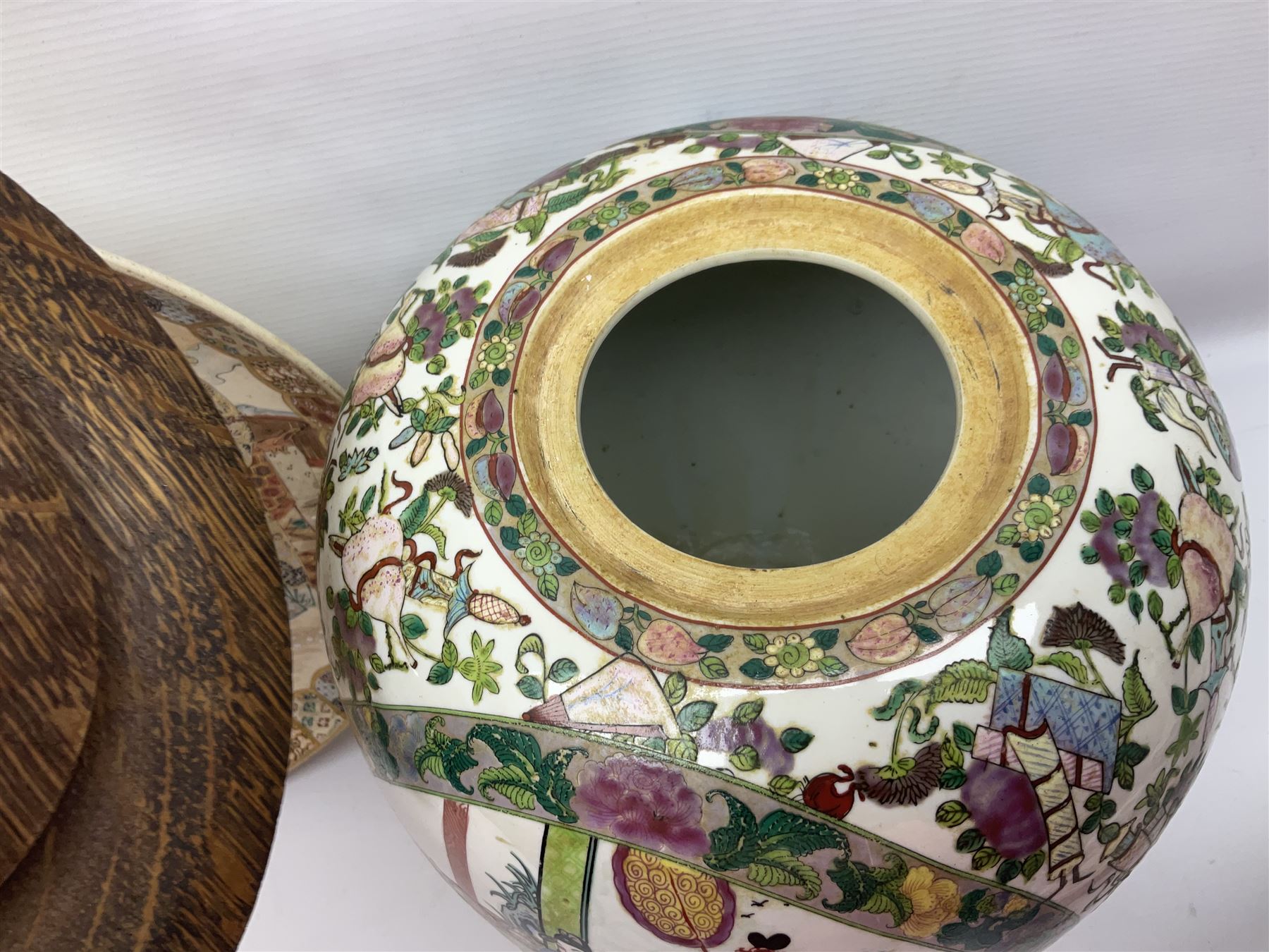 20th century Chinese famille rose jar, the body decorated in polychrome enamels with floral and foliate decoration on a white ground with a central figural panel and gilt key border to base, with six character mark beneath, H31cm, with later turned wooden cover, together with a similar footed bowl and jar,  jar cover with temple dog finial and a large Japanese Satsuma charger